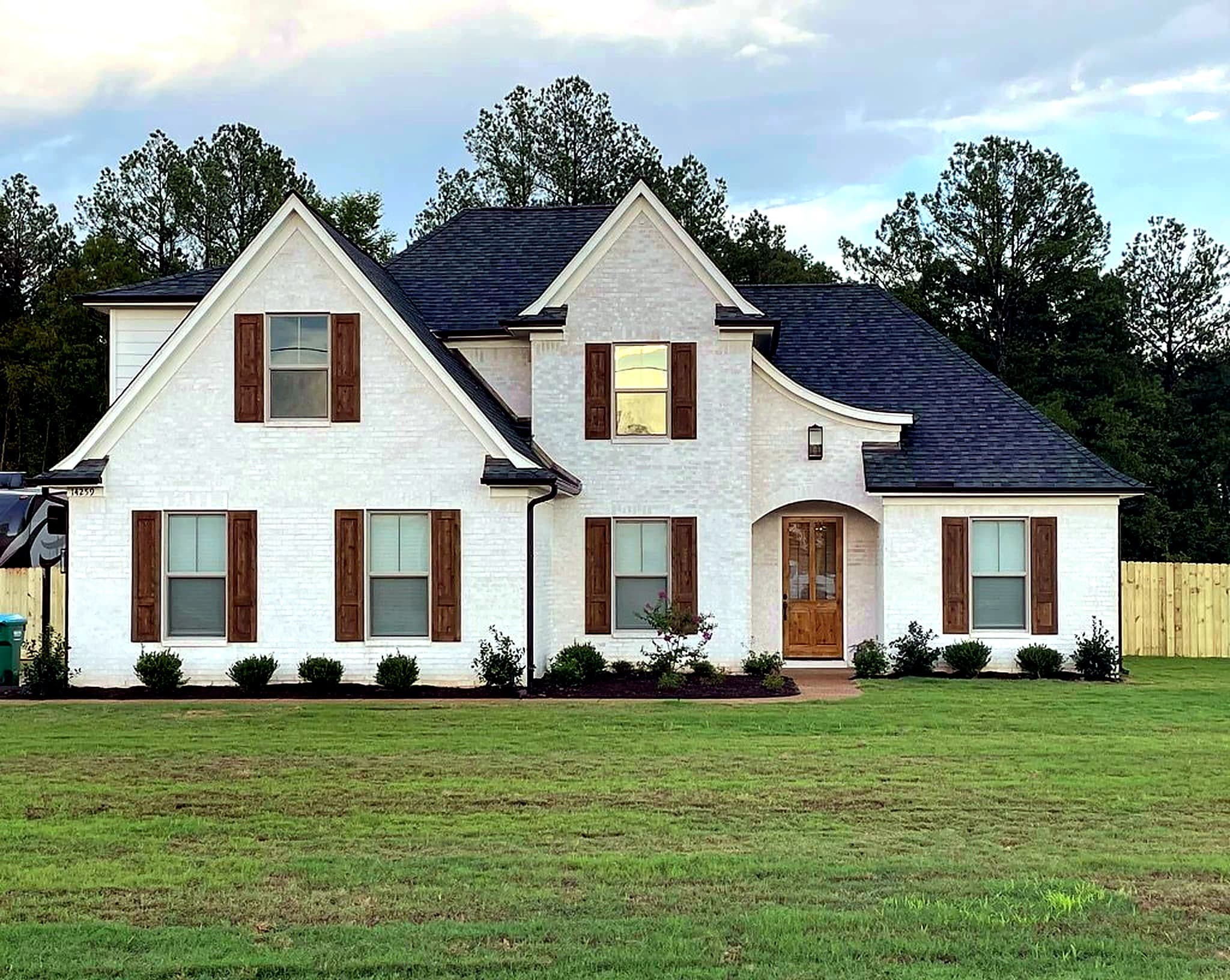 Custom farmhouse exterior by M & D Custom Homes